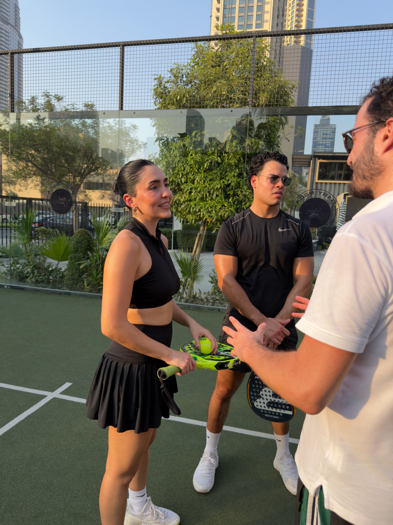 Guests connecting and chatting on the padel court